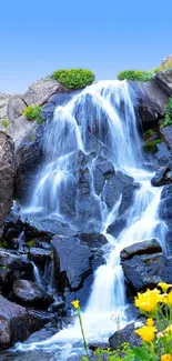 Tranquil waterfall cascading over rocks with vibrant nature background.