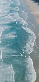 Tranquil beach with gentle ocean waves in a mobile wallpaper image.