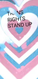 Heart-shaped trans pride wallpaper with a stand-up message.