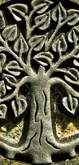 Intricate Tree of Life metal art with detailed leaves and textured background.