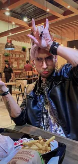 Stylish person in a cafe with food on table