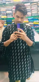 Mirror selfie with stylish patterned outfit in boutique.