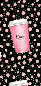 Pink coffee cups with polka dots on a black background wallpaper.