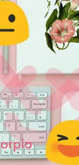 Stylish pink desk setup with emojis and floral decoration.