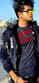 Stylish young man in navy jacket with sunglasses