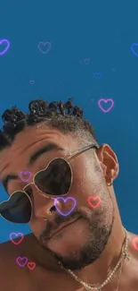 Man with heart-shaped sunglasses, blue backdrop.