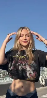 Young woman posing on urban rooftop with cityscape in background.