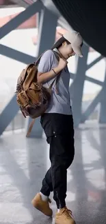 Modern individual in casual urban attire with backpack against a city backdrop.