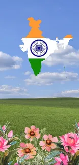 India map with tricolor and flowers against blue sky.