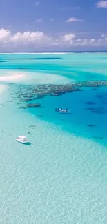 Aerial view of a tropical beach with turquoise water and white sand.