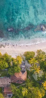 Aerial view of tropical beach with lush greenery and clear turquoise sea.