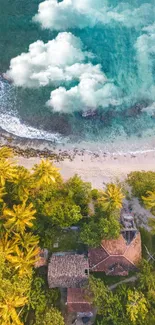 Aerial view of a tropical beach with lush greenery and clear blue ocean waters.