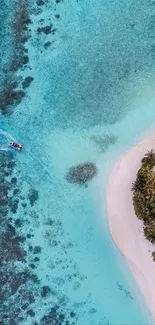 Aerial view of a tropical beach with turquoise waters and lush greenery.