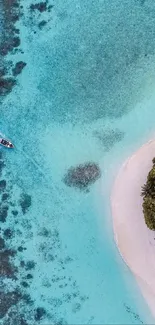 Aerial view of turquoise water and tropical beach with lush greenery.