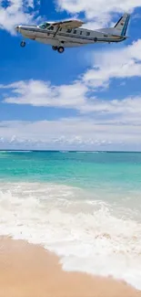 Plane flying above a tropical beach with turquoise waters.