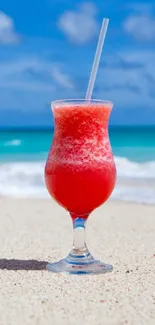 Tropical drink on a bright beach with blue ocean and sky.