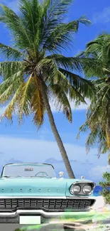 Vintage car on a tropical beach with palm trees and a blue sky.