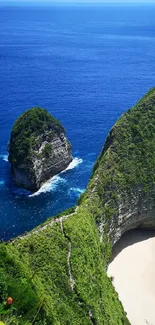 Breathtaking view of a cliff by a turquoise ocean with sandy beach.