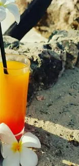 Tropical beach scene with cocktail on sand.