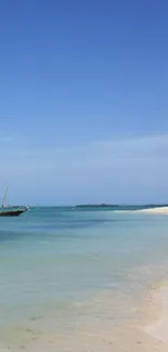 Tropical beach scene with azure water and clear blue sky.