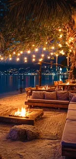 A cozy tropical beach at night with string lights and a firepit.