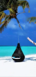 Tropical beach with turquoise sea and hanging chair under a palm tree.