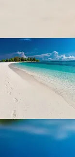 Tranquil tropical beach with blue water and white sand.