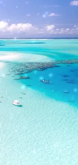 Aerial view of tropical beach with turquoise ocean and white sandy shore.