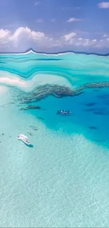 Aerial view of a tropical beach with turquoise ocean and lush greenery.