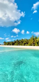 Scenic tropical beach with ocean and blue sky wallpaper.