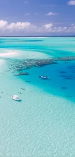 A stunning aerial view of a tropical beach with turquoise waters and a lush island backdrop.