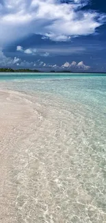 Mobile wallpaper of a tropical beach with clear waters and white sand under a blue sky.