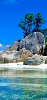 Tropical beach with blue skies and rocky formations on a sunny day.