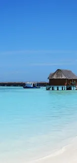 Woman walks along tropical beach with turquoise waters and blue sky in paradise.