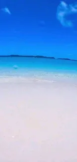Tropical beach with bright blue sky and serene ocean for mobile wallpaper.
