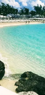 Tropical beach with turquoise waters and white sandy shores.