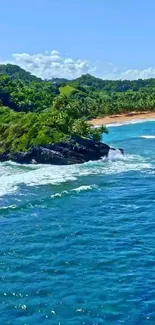 Vibrant tropical beach with blue ocean and lush green landscape.