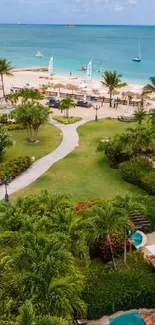 Aerial view of tropical beach resort with ocean and lush greenery.