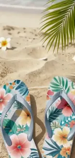 Colorful floral sandals on a sandy beach with palm leaves.