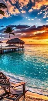 Tropical beach sunset with palm trees and vibrant sky.