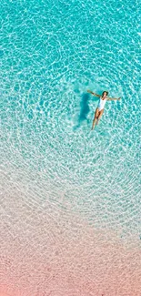 Woman floating in clear turquoise water, creating a tranquil beach vibe.