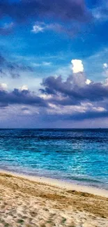 Tropical beach with blue ocean and vibrant sky wallpaper.