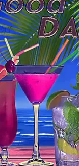 Tropical cocktails by the beach with palm leaves and blue ocean background.