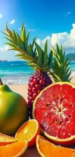 Tropical fruits on a sandy beach with blue ocean and sky.