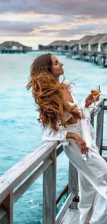 Woman in white relaxes by the tropical sea.