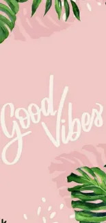 Tropical leaves on pink background with 'Good Vibes' text.