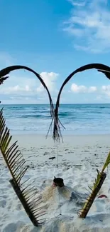 Heart-shaped palm leaves on a tropical beach with ocean view.