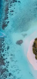 Aerial view of a tropical island with clear blue waters and lush greenery.