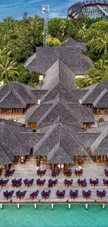 Aerial view of tropical island resort with beach and turquoise waters.