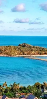 Scenic view of tropical island with blue ocean and lush greenery.